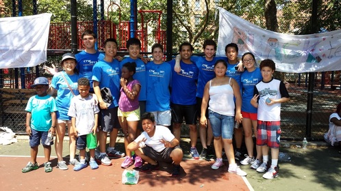 Goldman interns doing volunteering work for teaching underprivileged children.